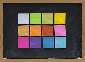 Image showing colorful sticky notes on blackboard