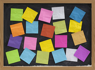 Image showing colorful blank notes on blackboard