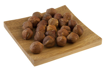 Image showing handful of filberts (hazelnuts) on a small wooden tray