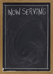 Image showing now serving on blackboard