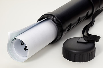 Image showing poster in a black plastic tube