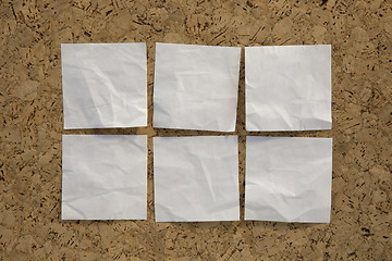 Image showing six blank white reminder notes on cork board