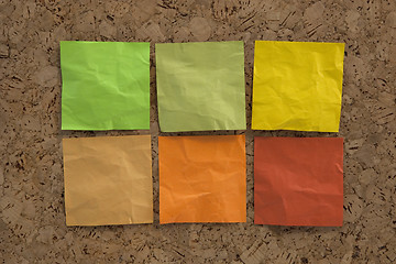 Image showing blank crumpled sticky notes in earth colors