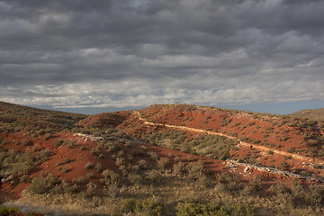 Image showing desert hilly landscape under stormy sky