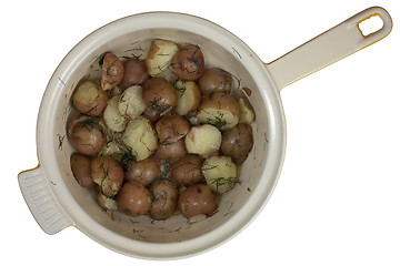 Image showing freshly cooked young red potatos in a pot