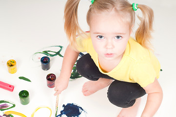 Image showing Little girl painting