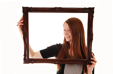 Image showing Girl with picture frame.