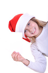 Image showing cute little smiling Santa girl with a banner