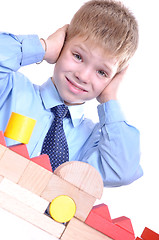 Image showing schoolboy playing with bricks