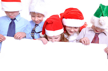 Image showing Christmas children with a banner