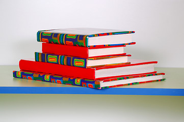 Image showing pile of books on shelf