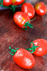 Image showing wet tomatoes bunch