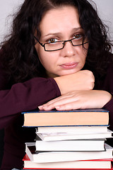 Image showing woman with stack of books