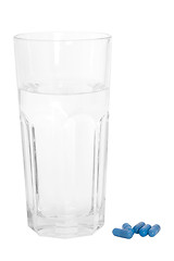 Image showing Glass of Water and Blue Pills