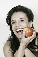 Image showing Young happy smiling woman with red apple