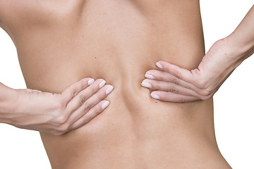 Image showing Woman massaging lower back pain