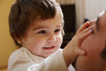 Image showing Baby girl playing with dad