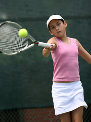 Image showing Young girl playing tennis