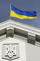 Image showing Ukrainian flag waving on government building