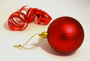 Image showing A bright red Christmas tree decoration on white