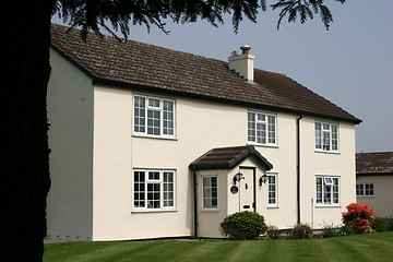 Image showing A beautiful white cottage