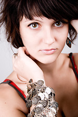 Image showing young brunette lady with bracelets
