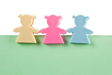 Image showing 3 female figurines on blank paper