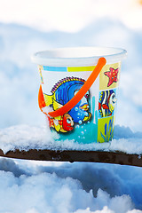 Image showing Toy bucket on the snow