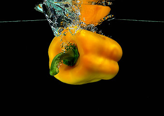 Image showing Pepper falling into water