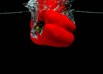 Image showing Pepper falling into water