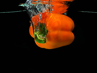 Image showing Pepper falling into water