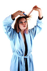 Image showing Girl brushing hair.