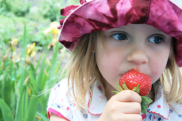 Image showing eating sweet strawberry