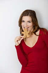 Image showing Bitting a Gingerbread cookie