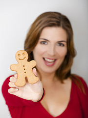 Image showing Holding a Gingerbread cookie