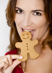 Image showing Bitting a Gingerbread cookie