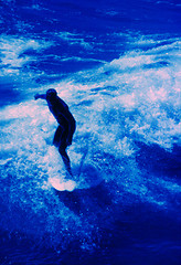 Image showing surfer rides wave. C41 film cross processed E6, grainy and contrasty shot.