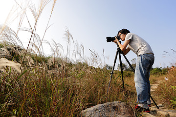 Image showing Photographer taking photo