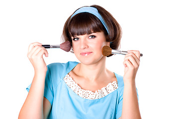 Image showing brunette woman with two make-up brushes 