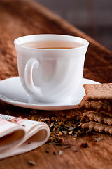 Image showing cup of herbal tea and some fresh cookies 