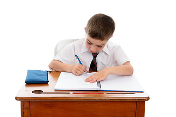 Image showing Little boy doing school work or homework