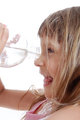 Image showing thirsty child playing with water