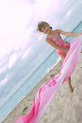 Image showing child playing with  at the beach