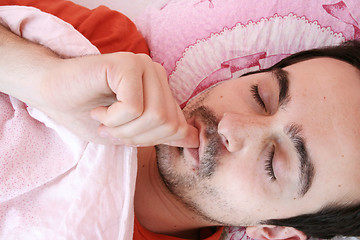 Image showing Young man sleeping .