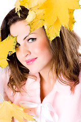 Image showing beautiful young woman with yellow leaves 