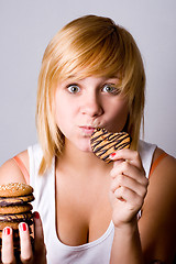 Image showing woman eating chocolate chip cookies