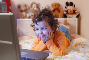 Image showing little girl in front of a laptop