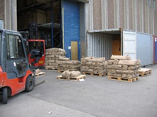 Image showing Unloading container outside warehouse