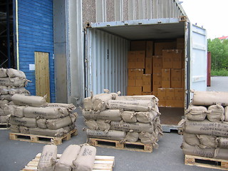 Image showing Unloading container outside a warehouse