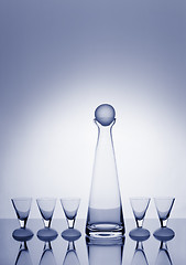 Image showing Decanter and five glasses backlit and blue-toned